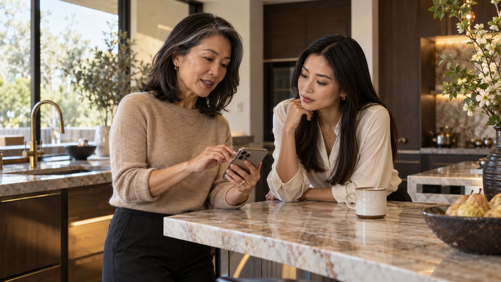 The same woman and her adult daughter calmly discussing a message at home.