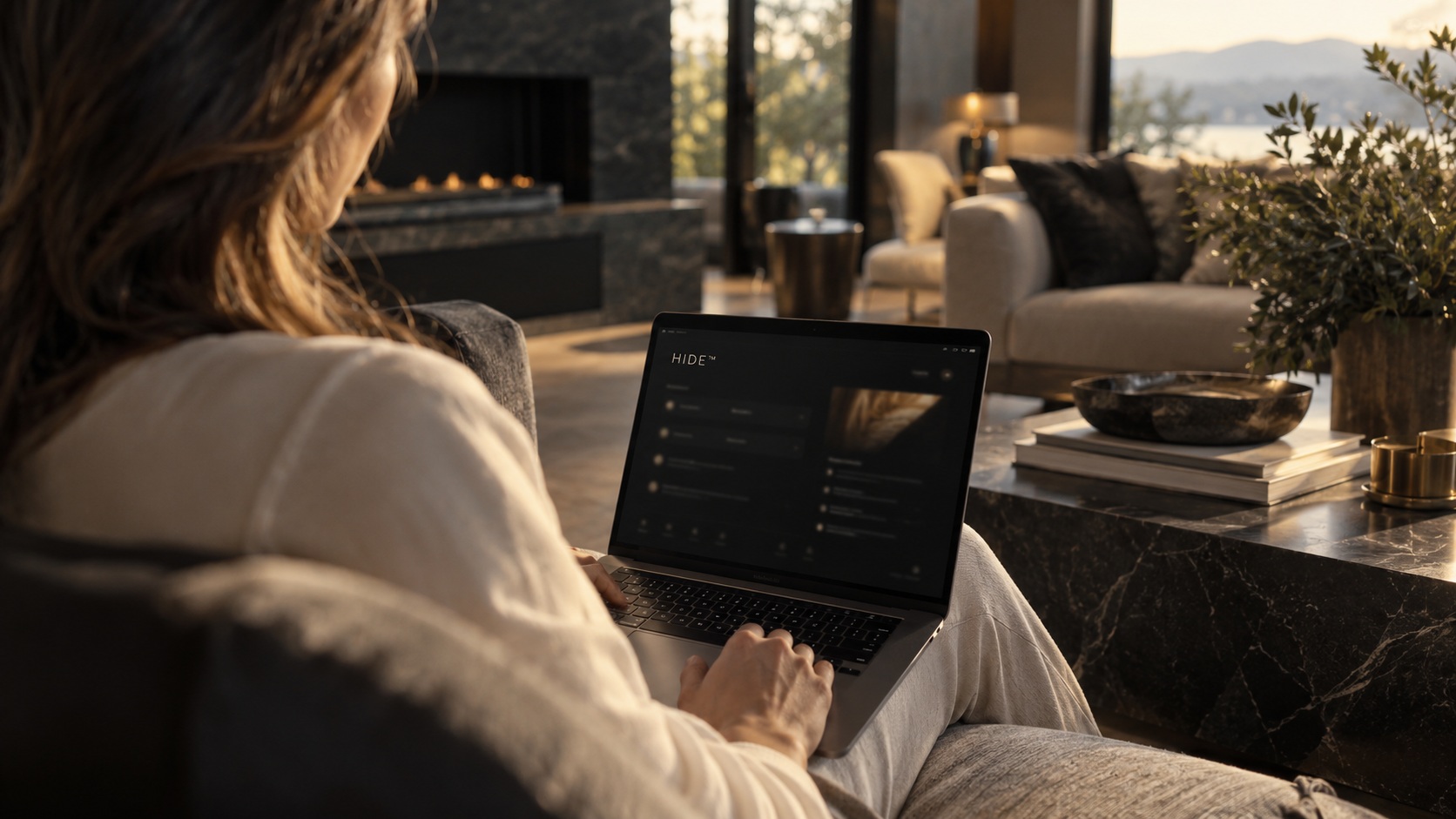 A client using a private dashboard, seen over the shoulder with screen detail intentionally out of focus.